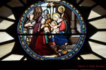 Stained glass window depicting the Nativity scene in Bethlehem