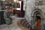 Exit from the Grotto with Armenian priest, inside the Church of the Nativity in Bethlehem